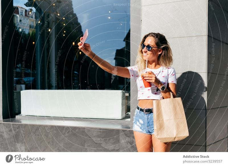 Cheerful woman leaving restaurant cafe drink healthy smile smartphone paper bag leave female urban vitamin beverage juice smoothie cup detox cheerful delighted