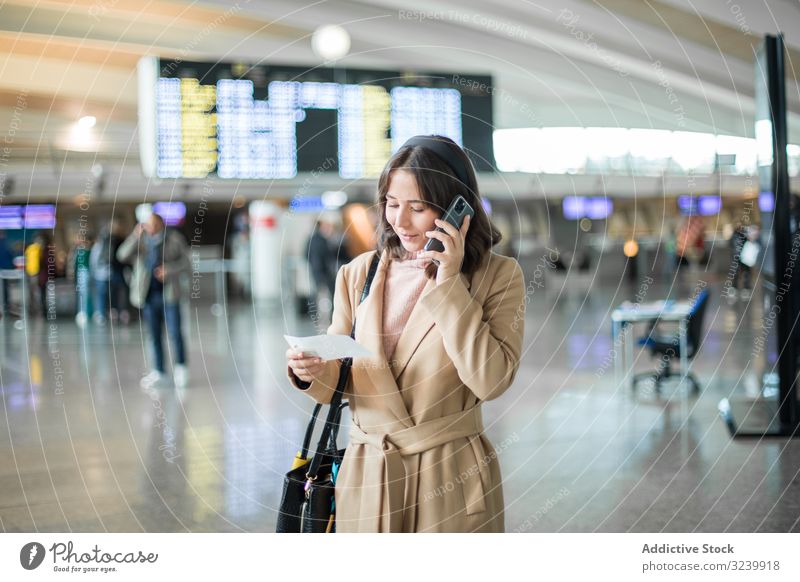 Woman using smartphone at airport traveler texting waiting hall departure airplane woman mobile businesswoman terminal browsing watching talking surfing
