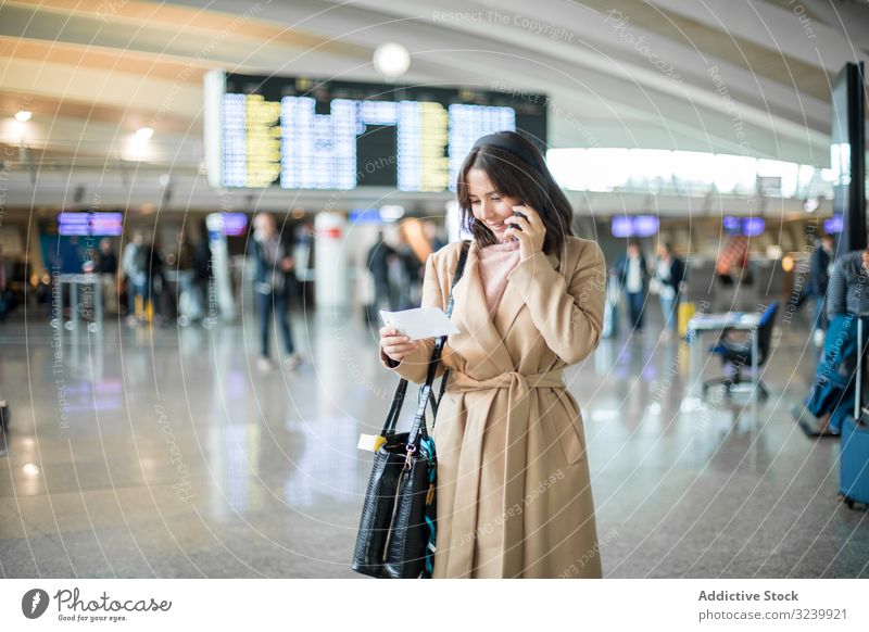 Woman using smartphone at airport traveler texting waiting hall departure airplane woman mobile businesswoman terminal browsing watching surfing talking