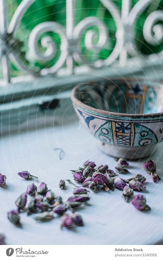 Dried flower buds and bowl near window dried open home traditional arabic ornament marrakesh morocco herb natural organic dishware harmony idyllic calm tranquil