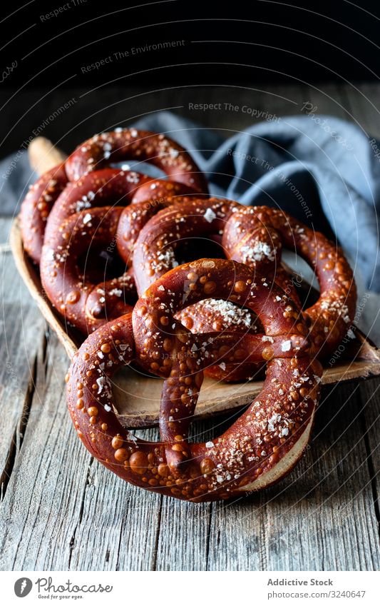 Delicious baked pretzels on wooden table snack food salted fresh delicious traditional cuisine german tasty savory gourmet unhealthy bakery appetizing