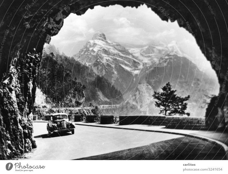 Gateway to the world Alps Car Vintage car Tunnel Mountain Panorama (View) Black & white photo Vacation & Travel Travel photography Experience