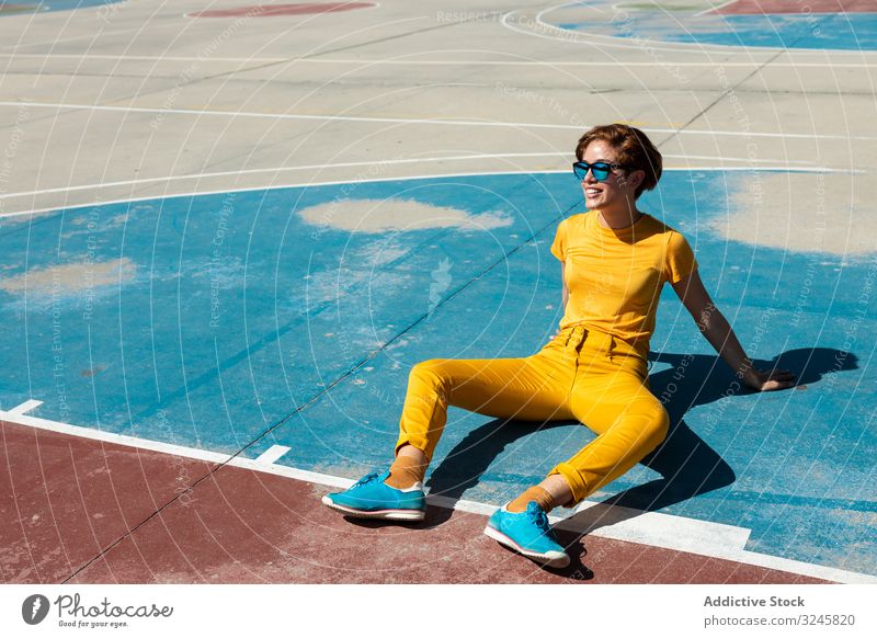 Trendy young woman on playground in sunny day frown teen cool millennial colorful urban female summer style teenager vibrant vivid contemporary modern