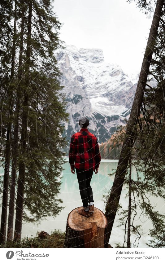 Man delighting in views near lake and mountains tourism water boat fog cloudy mist travel landscape vacation adventure nature beautiful sky scenic holiday rock