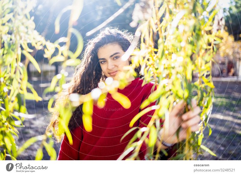 Portrait of a young woman with a red sweater Lifestyle Style Happy Beautiful Garden Schoolchild Human being Feminine Young woman Youth (Young adults) Woman
