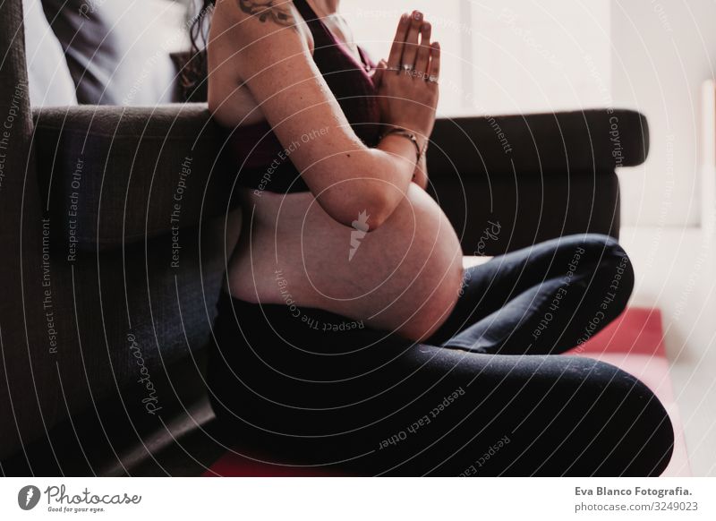 young pregnant woman at home practicing yoga sport. healthy lifestyle Pregnant Woman Yoga Home Sports Healthy Lifestyle Youth (Young adults) Caucasian Parenting