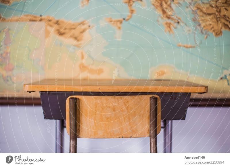 Empty desks at school classroom with world map. House (Residential Structure) Furniture Desk Chair Table Adult Education Child School Classroom Blackboard