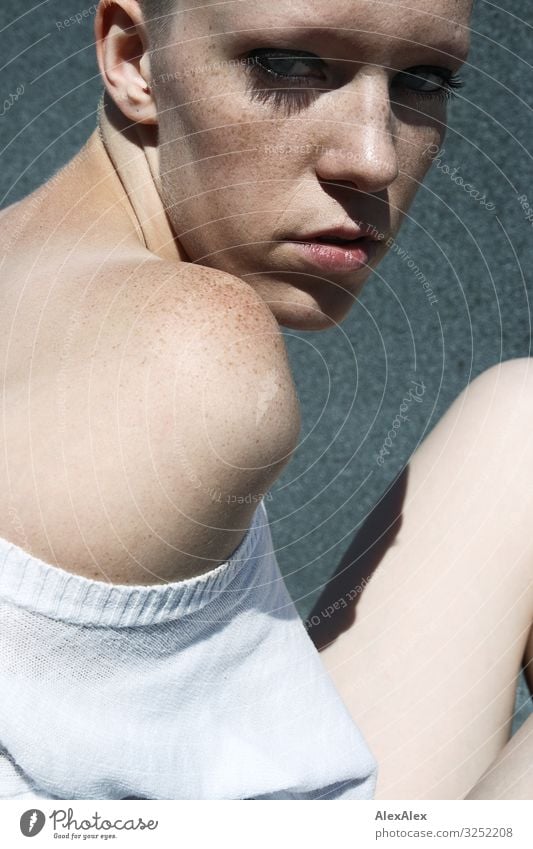 Close up portrait of young woman looking back over her shoulder with lots of freckles Style pretty Calm Young woman Youth (Young adults) Face Shoulder Freckles