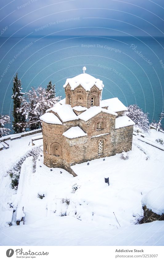 Old Orthodox church on lake coast shore snow old orthodox winter cold north macedonia ohrid weather cool ancient aged religion hope worship architecture