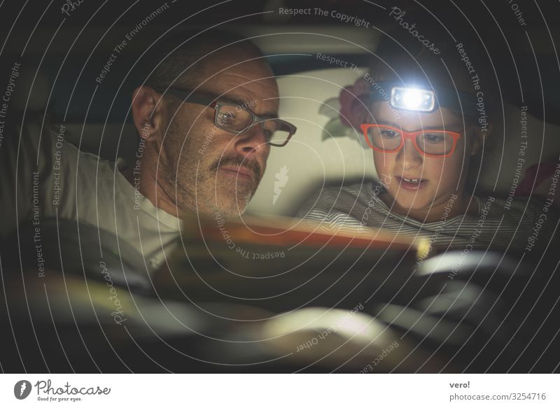Headlamp, girl, reading, dad Girl Father Adults 2 Human being Eyeglasses Moustache headlamp Discover Relaxation To enjoy Listening Reading Lie Looking Dark