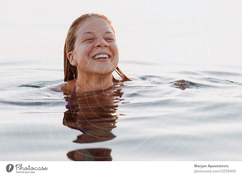 Young happy woman smiling and swimming in the sea Lifestyle Joy Vacation & Travel Tourism Freedom Summer Summer vacation Human being Feminine Young woman