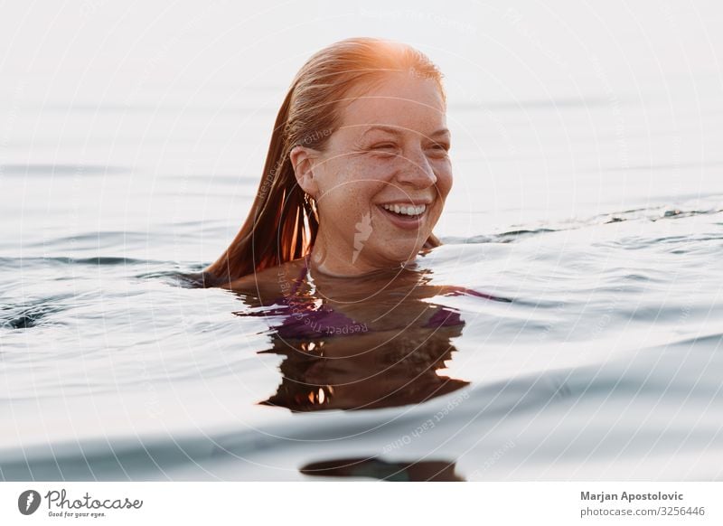 Young happy woman swimming in the sea in sunset Lifestyle Joy Vacation & Travel Tourism Freedom Summer Summer vacation Human being Feminine Young woman