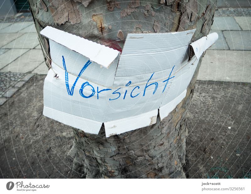 caution lost Tree trunk Prenzlauer Berg Sidewalk Cardboard Word Pen Letters (alphabet) Simple White Safety Modest Fear of the future Problem solving Puzzle