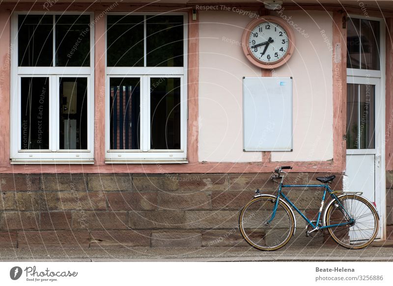Just before seven: Bicycle under the clock at a dead station Train station Small Closed Clock Station clock Old turned off Window Colour photo Deserted