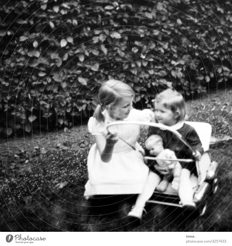 Relationship - Two girls with pram and doll in front of a hedge Feminine Toddler Girl 2 Human being Hedge Park Meadow Lanes & trails Baby carriage Dress Blonde