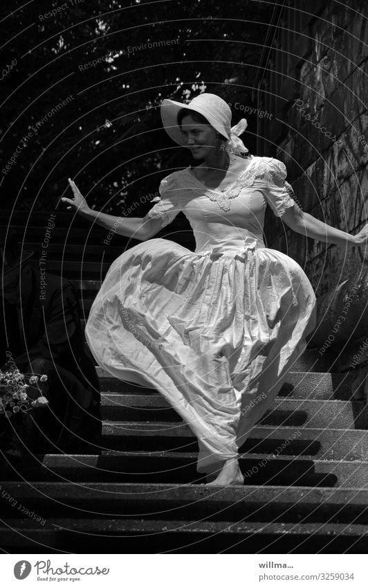 Woman in a nostalgic wedding dress and hat walks barefoot down a staircase - Queen of hearts Feminine Bride Wedding dress Beautiful Barefoot Elegant Graceful