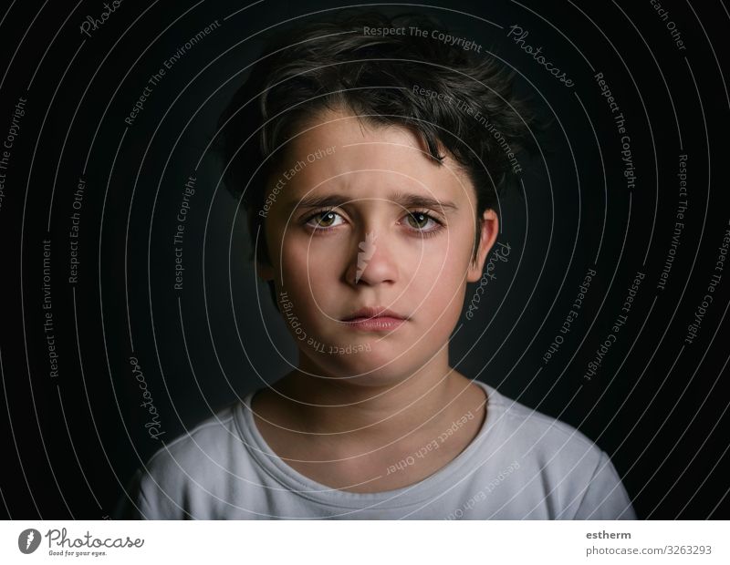 Portrait of sad child on black background Human being Child Boy (child) Infancy 1 8 - 13 years Think Sadness Cry Gloomy Emotions Hope Pain Loneliness Guilty