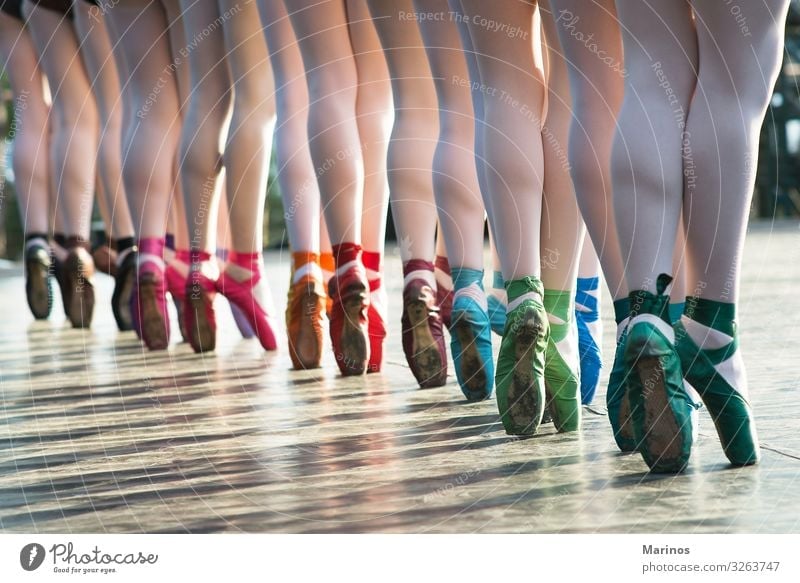 Ballerinas feet dancing on ballet shoes with several colors. Elegant Dance Woman Adults Legs Art Dancer Ballet Footwear Movement Energy Colour ballerina