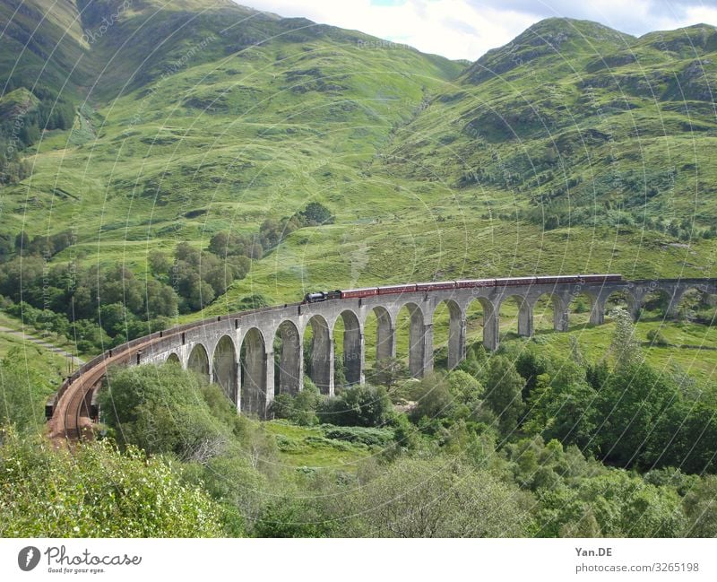 View to the popular bridge to Hogwarts in Scotland, knows from the Harry Potter films. buzzer medieval stone material construction industry history travel