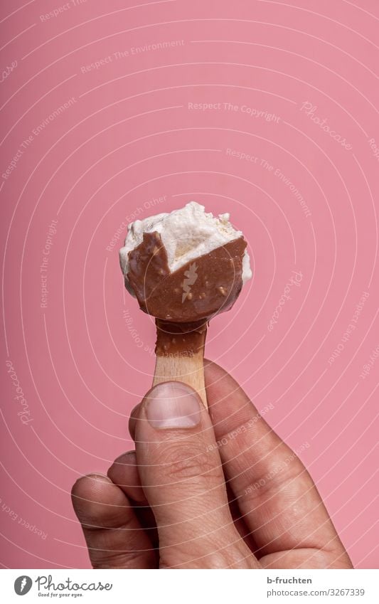 ice age Food Dessert Candy Nutrition Eating Hand Fingers Select To hold on To enjoy Fresh Pink Ice cream Lick Delicious Unhealthy ice lollipop ice on a stick