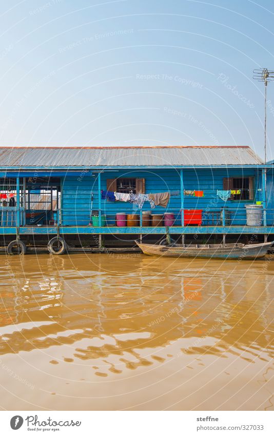 longing Water Cloudless sky Beautiful weather Lake Tonle Sap lake Cambodia Fishing village House (Residential Structure) Esthetic Authentic Exceptional Poverty
