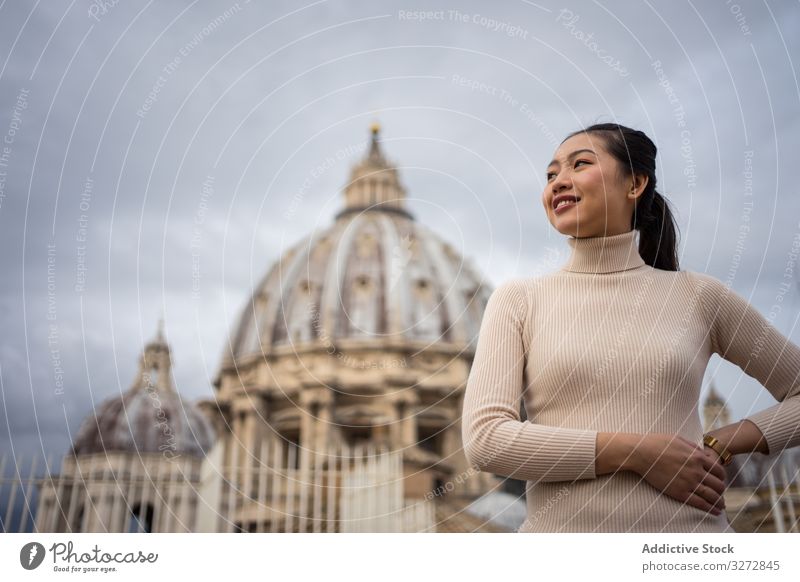 Asian female traveler walking at old city tourism architecture historical exterior building sightseeing woman ancient temple asian saint peter basilica vatican