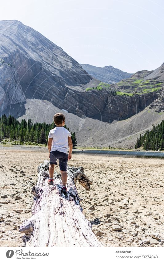 Little kid looking a dry mountain lake Lifestyle Joy Happy Vacation & Travel Trip Freedom Summer Summer vacation Beach Mountain Climbing Mountaineering Child