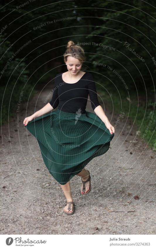 Woman with green pleated skirt dancing on a forest path Feminine Adults 1 Human being 18 - 30 years Youth (Young adults) Pleated skirt thong sandals Brunette