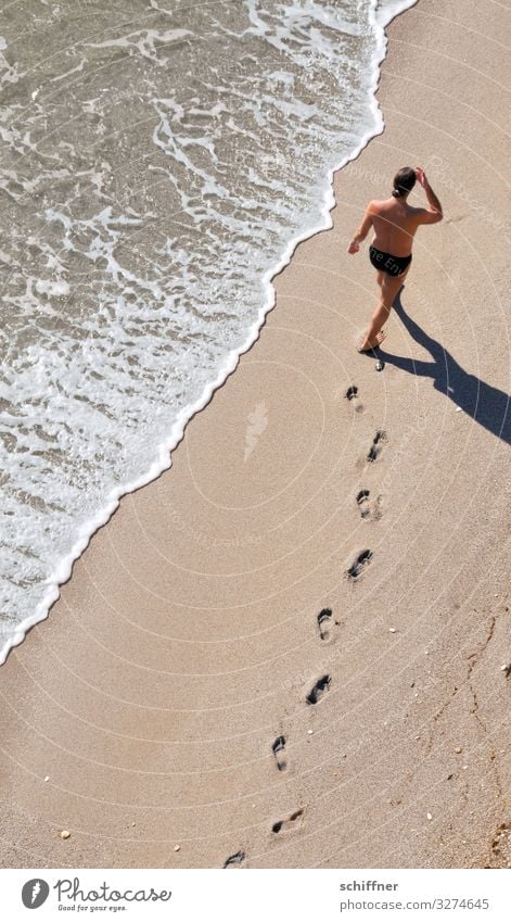 Man walking on the beach vacation Vacation mood ready for a holiday Beach Walk on the beach Ocean Seashore Footprint Barefoot barefoot beach Sea water Waves