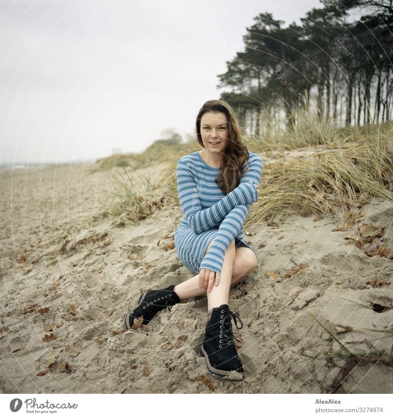 Young woman sitting on dune at the Baltic Sea beach Style Joy Beautiful Life Well-being Trip Adventure Youth (Young adults) Adults 18 - 30 years Landscape