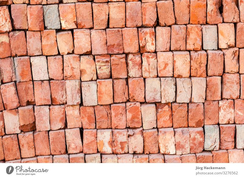 staple of new bricks at the construction site Construction site Rock Architecture Stone Rust Brick Old Strong Brown Gray Red background backgrounds block broken