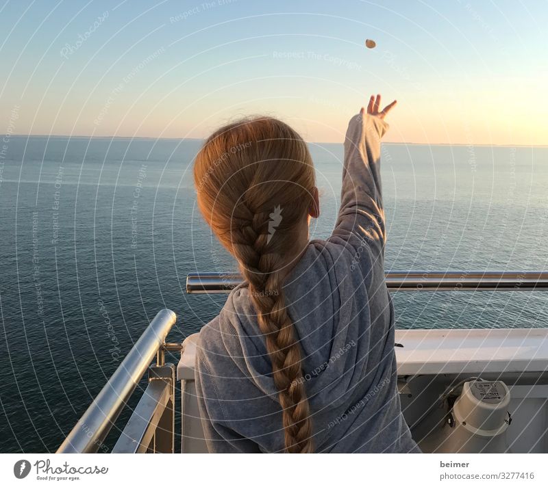 Make a wish. Far-off places Girl Hair and hairstyles Back 1 Human being 8 - 13 years Child Infancy Water Cloudless sky Horizon Sunrise Sunset Summer Ocean
