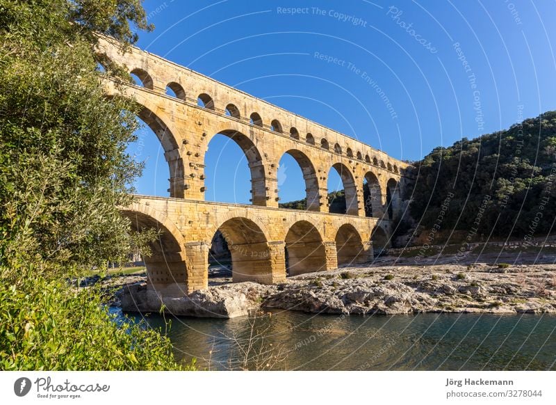 Pont du Gard is an old Roman aqueduct near Nimes Sightseeing Summer Culture Landscape Earth Sky River Ruin Bridge Architecture Monument Stone Old Historic