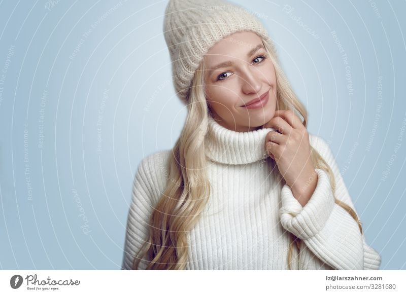 Beautiful woman in white knitted sweater and hat Happy Face Winter Woman Adults 1 Human being 18 - 30 years Youth (Young adults) Warmth Sweater Hat Blonde