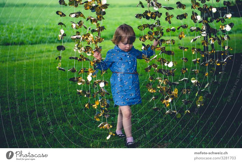 Girl and golden garland on green meadow 1 Human being 3 - 8 years Child Infancy Nature Summer Meadow Dress Playing Happy Natural Blue Gold Green Joy