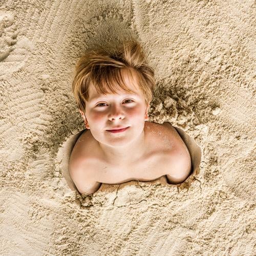 happy young boy covered by fine sand Joy Happy Playing Vacation & Travel Beach Child Boy (child) Youth (Young adults) Sand Laughter Friendliness Cute Ko Samet