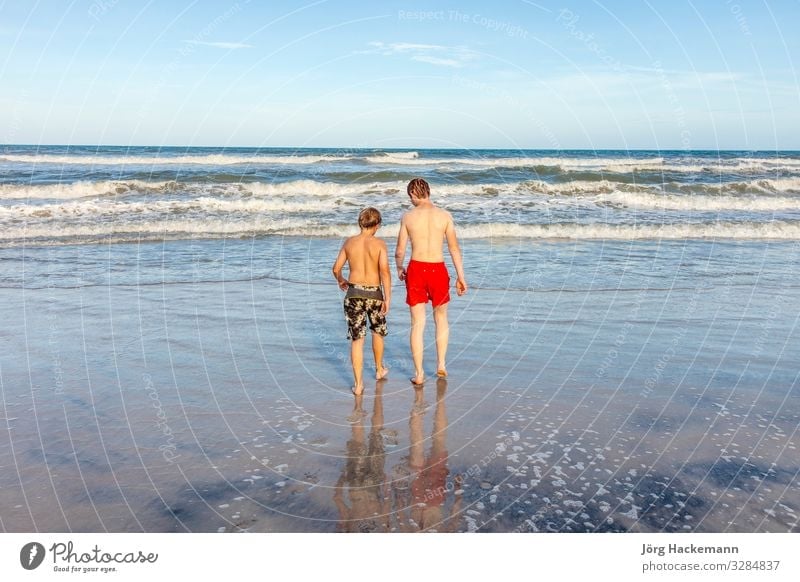 boys relaxing at the beach Joy Happy Beautiful Body Skin Face Leisure and hobbies Playing Vacation & Travel Sun Beach Ocean Waves Child Boy (child)