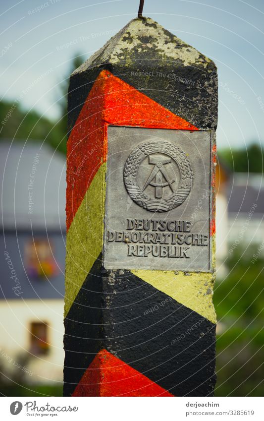 Time History. An old GDR border stone with the inscription: GERMAN DEMOCRATIC REPUBLIC: Design Trip Environment Summer Beautiful weather Park Thuringia Germany