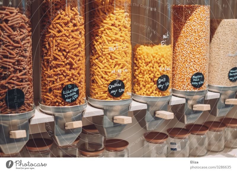 Container with different types of pasta in a packaging-free supermarket; sustainability unpacked package-free Grain Supermarket Sustainability