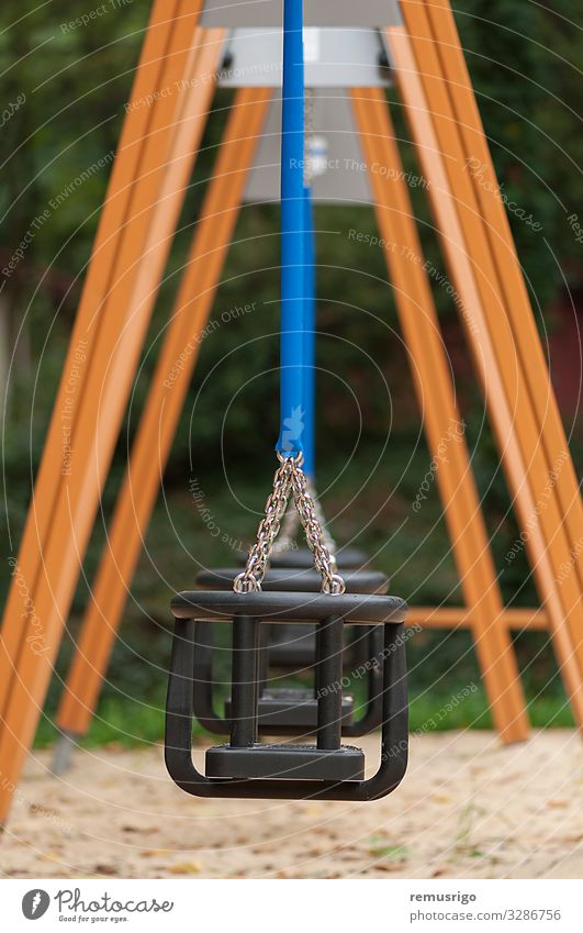 Empty swing for children Relaxation Kindergarten Child Infancy Park Playground Blue Safety chain iron wood Colour photo Exterior shot Deserted Day