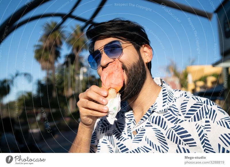 Man enjoying sunny weather while eating an ice cream Dessert Ice cream Eating Lifestyle Joy Happy Beautiful Vacation & Travel Summer Human being Adults Street