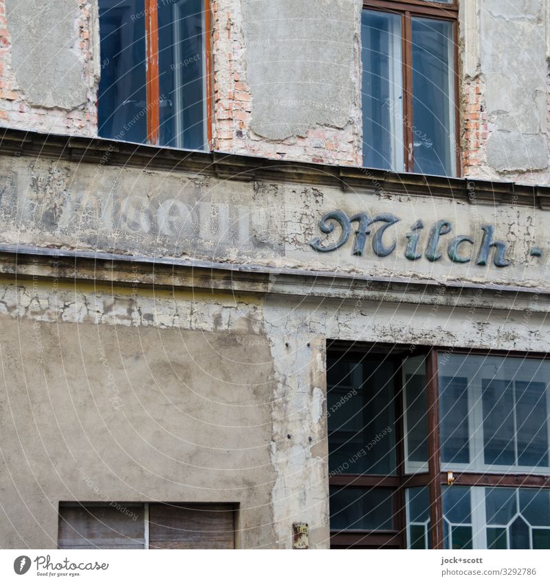 Hairdresser milk and the time Trade lost places goerlitz Facade Window Word Old Authentic Historic Gray Style Past Transience Ravages of time Weathered Vacancy