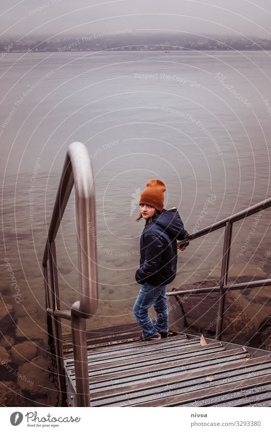 Boy stands at stairs to lake Lifestyle Leisure and hobbies Human being Masculine Child Boy (child) Infancy Youth (Young adults) 1 8 - 13 years Environment