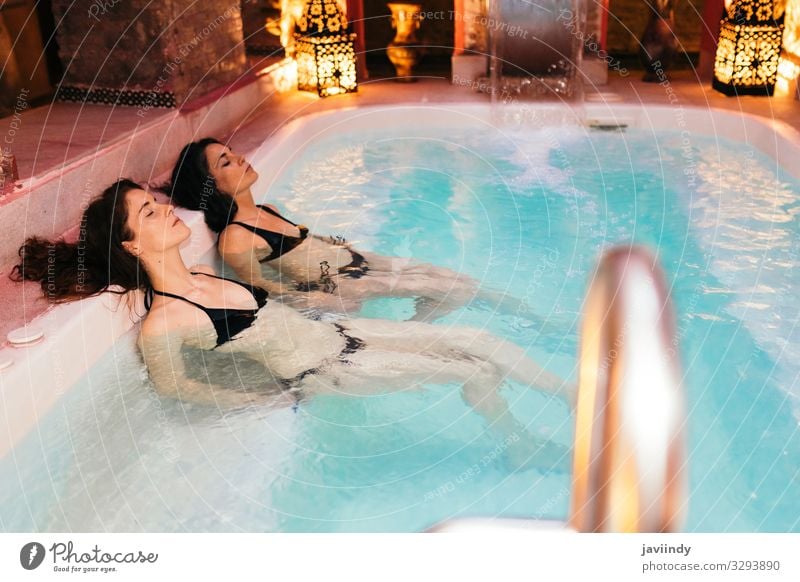 Two women enjoying Arabic baths Hammam in Granada Lifestyle Luxury Beautiful Medical treatment Relaxation Spa Sauna Swimming pool Leisure and hobbies Decoration