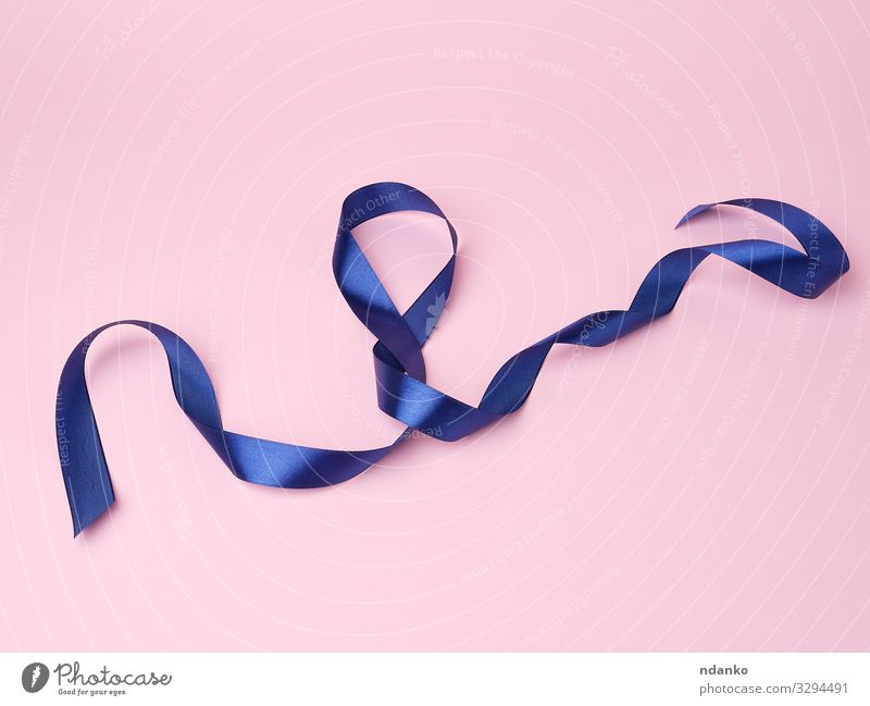 blue silk thin ribbon twisted on a pink background Design Decoration Feasts & Celebrations Christmas & Advent Birthday Tool Cloth Curl Line Blue Pink Colour