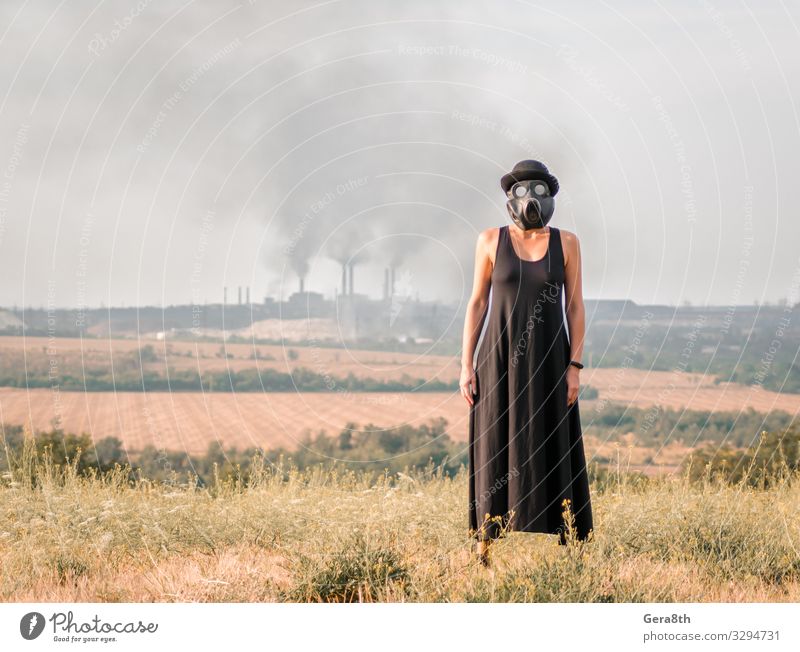 young girl in a black dress and gas mask Factory Human being Woman Adults Environment Nature Landscape Plant Sky Grass Dress Hat Natural Black Protection