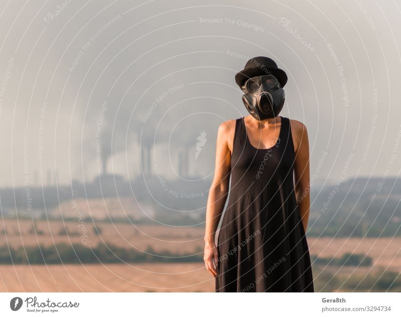 young girl in a black dress and gas mask Factory Human being Woman Adults Environment Nature Landscape Plant Sky Dress Hat Natural Black Protection Disaster