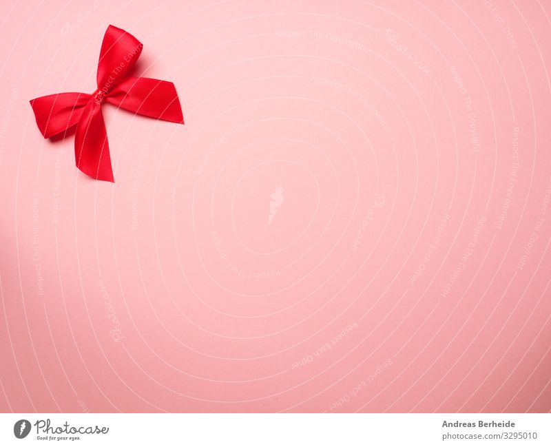 Red ribbon on pink background Style Valentine's Day Birthday Decoration Bow Love Pink surprise above abstract anniversary Background picture beautiful beauty