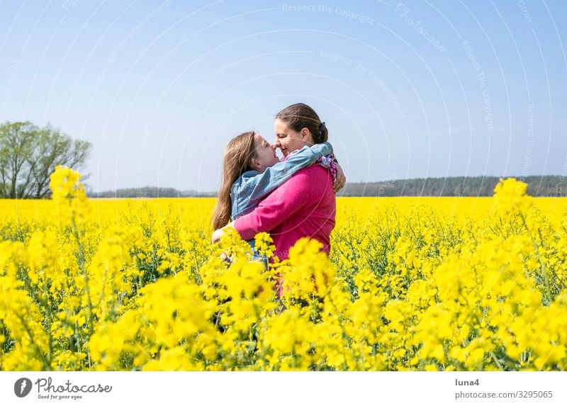 Mother and daughter in a rape field Joy Happy Contentment Vacation & Travel Child Girl Adults Family & Relations Nature Spring Blonde Laughter Happiness