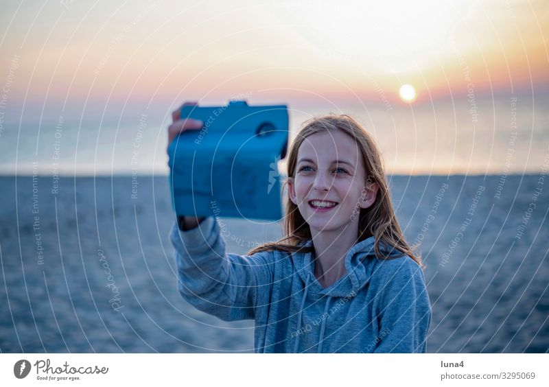 happy girl with smartphone Joy luck Contentment Ocean Child PDA Nature Baltic Sea Blonde Long-haired Laughter Happiness Positive Emotions Hope Selfie teenager